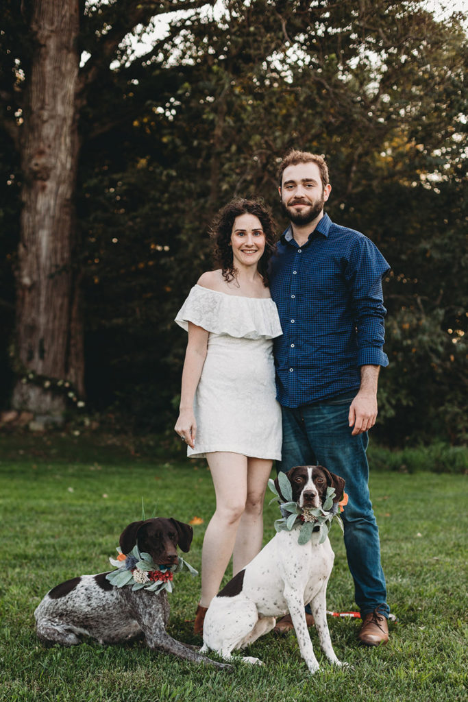 man and woman and two dogs during their Artisan Acres Estate engagement