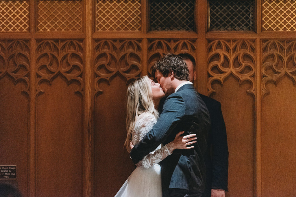 close up photo of bride and groom's first kiss at beck chapel during their indiana university wedding