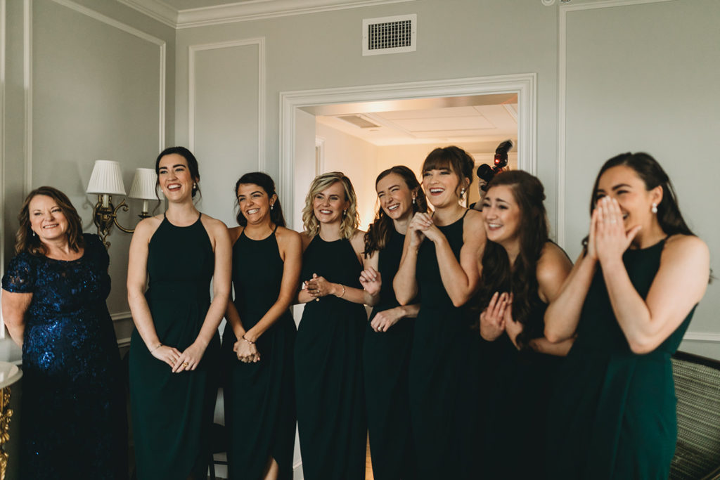 bridesmaids see bride for first time and squeal with joy during their charming carmel wedding