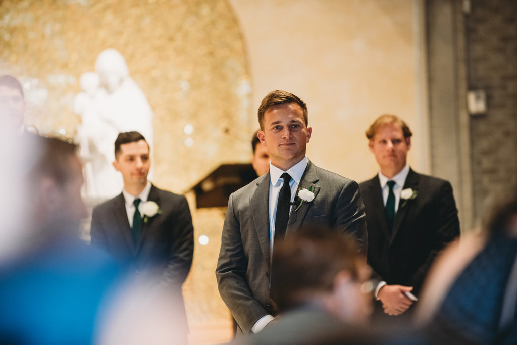 groom sees bride walking down aisle during their charming carmel wedding