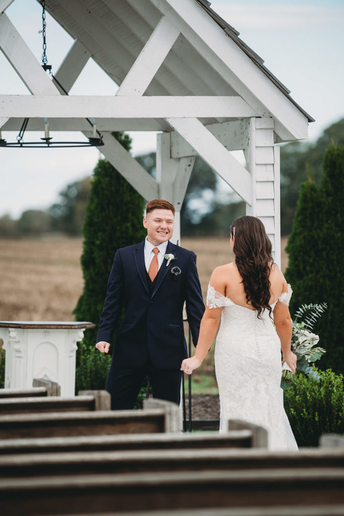 groom with red hair sees bride for first time during their white willow farms wedding
