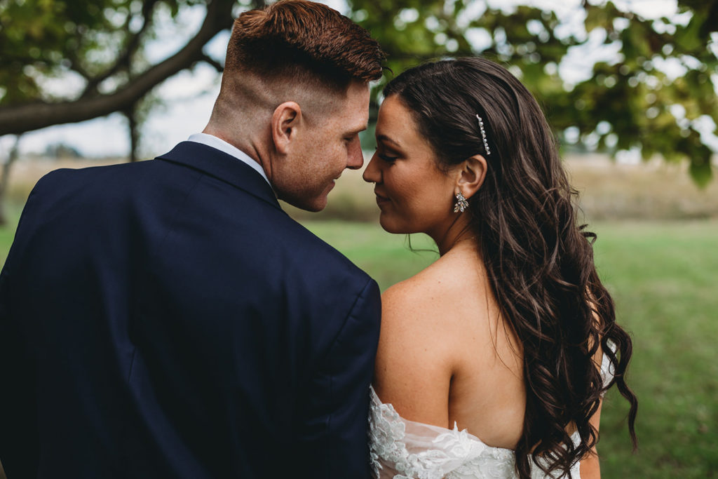 bride and groom touch foreheads during their white willow farms wedding