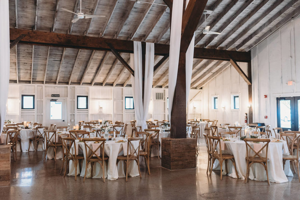 wide shot of interior of reception space set up for wedding during their white willow farms wedding